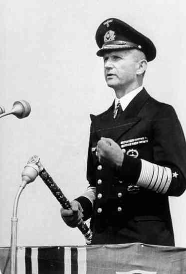 Grossadmiral Karl Donitz, commander of the U-boat force holding the admiral's baton,...