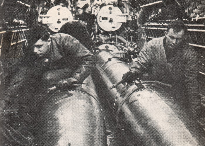 Preparaton torpedos for attack on convoy