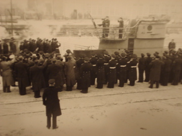 U-410 during her commissioning ceremony 23 Feb 1942. There is an inscription at the...