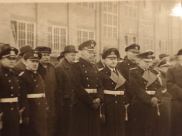 Kriegsmarine authorities and civilian workers witness the commissioning ceremony...