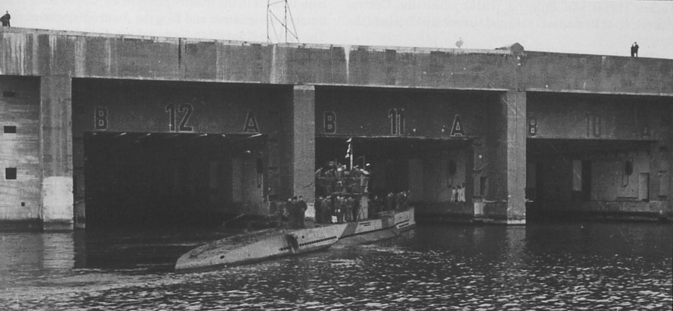 U-136 sails into a bunker in Lorient. Note the bunker numbers.