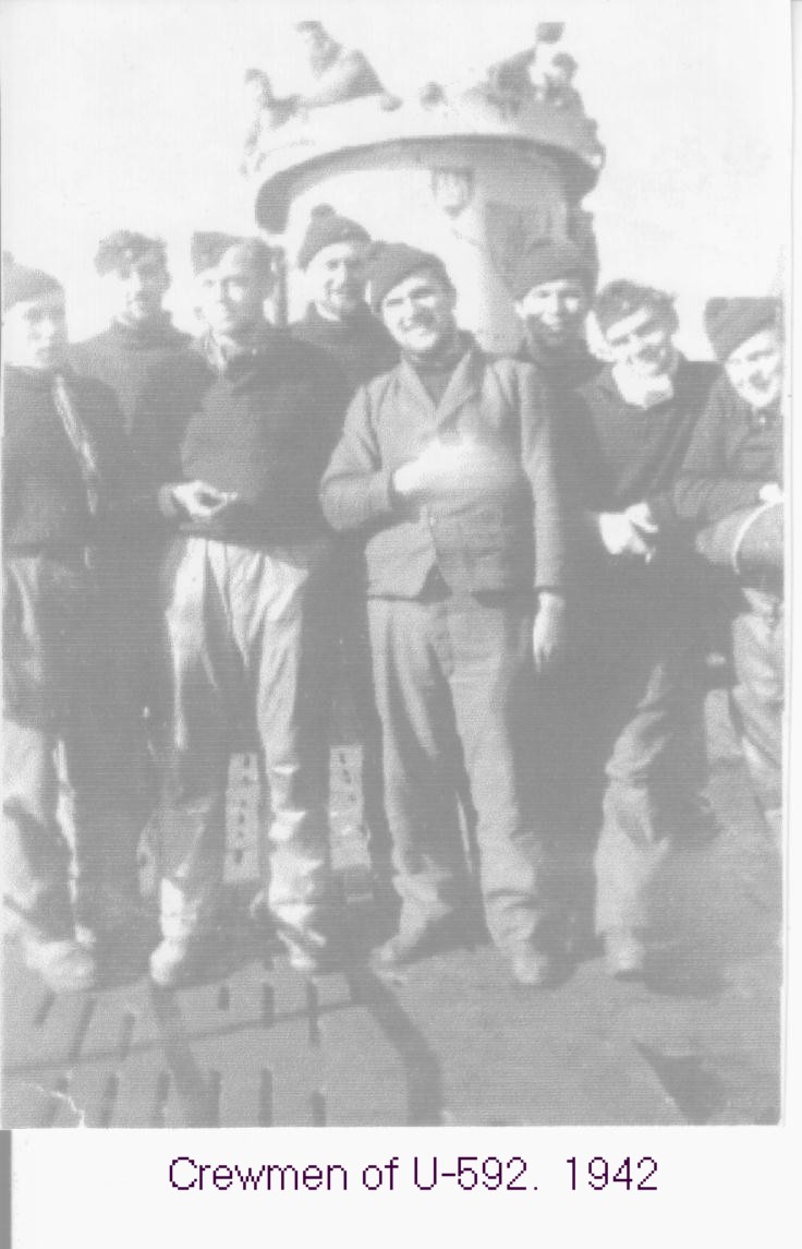 Crewmen of the U-592. The boat's emblem is barely visible on the conning tower. Also...