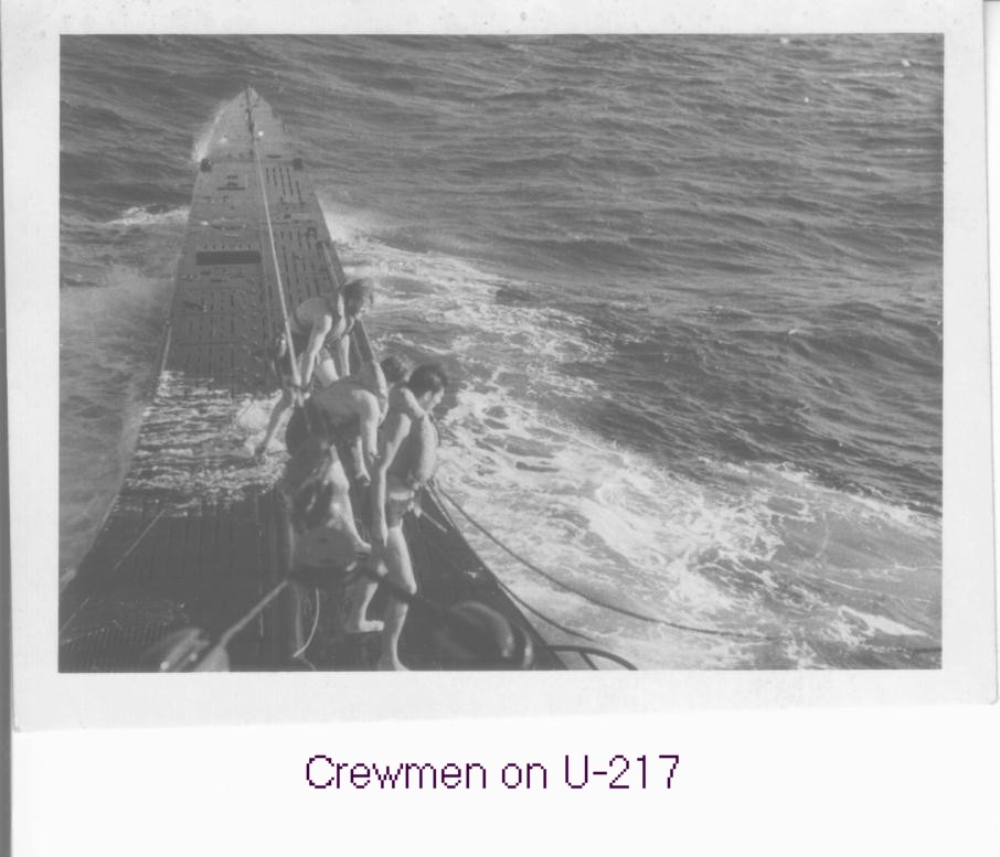 Taken from the conning tower of U-217, crewmen can be seen wearing life lines which...