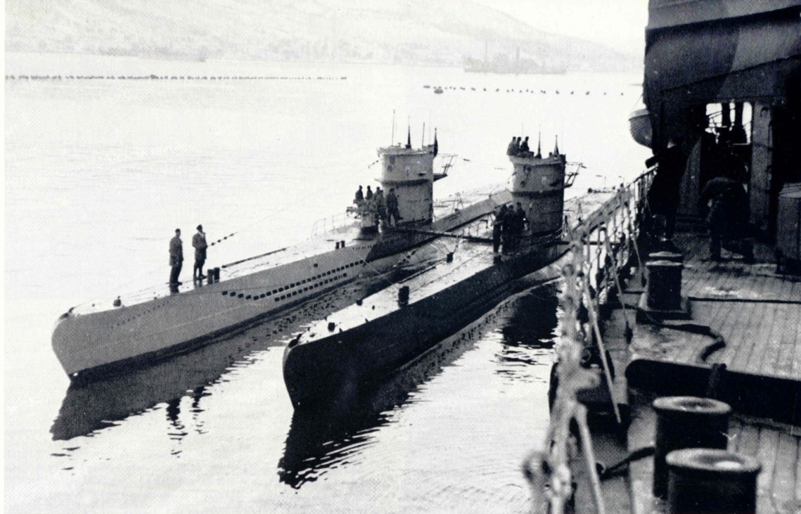 Two Type VIIC of the 11th flotilla next to a supply ship.